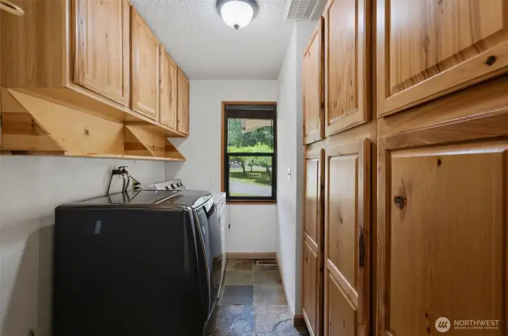 This practical layout includes a separate utility and laundry area located just off the main living spaces.