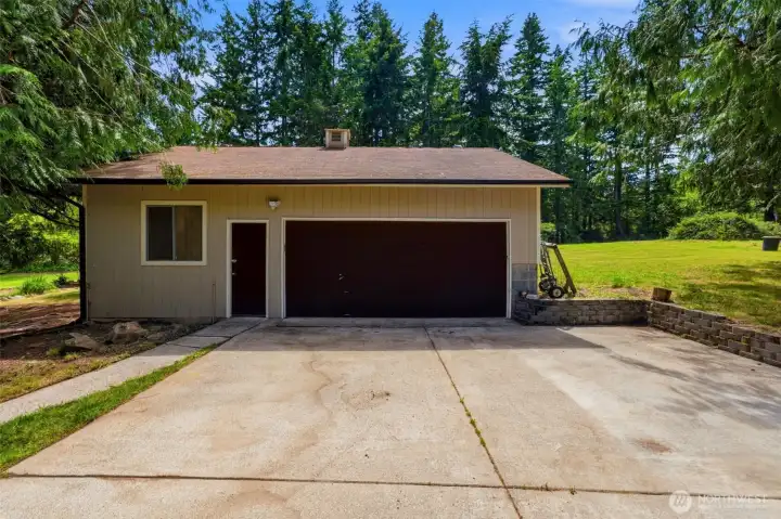 Ready for all your hobbies and gear. This 2 car garage is complete with extensive garage space and a dedicated workshop room. It is also wired for a generator to support the property during any power outages.