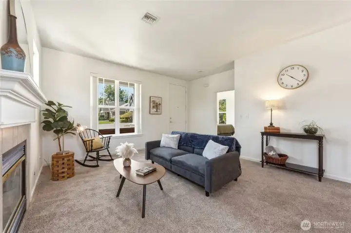 Natural Light for DAYS in this perfectly sized living room.