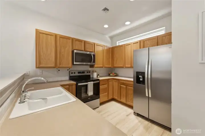BRAND NEW refrigerator and stove/oven.