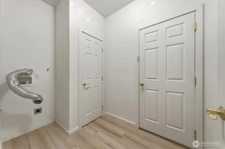 Utility Room with closet and door to garage.
