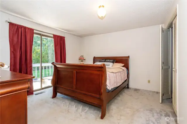 Bedroom easily accommodates queen-sized bedroom suite of furniture.