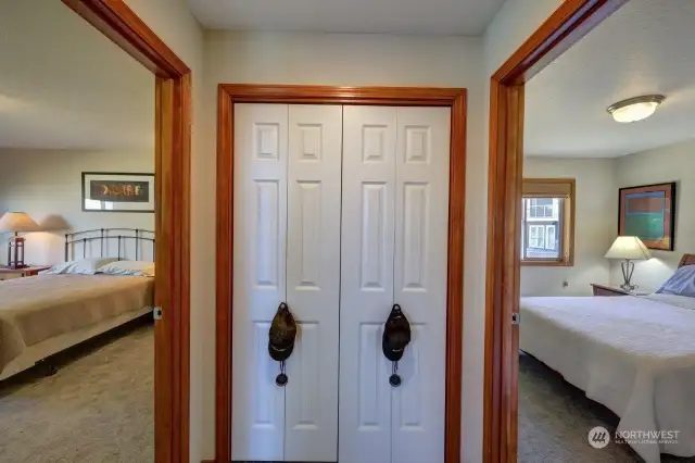 Pantry closet is located between the  guest bedrooms by the kitchen