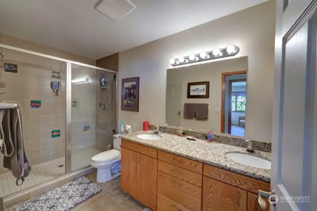 Main bathroom has custom walk-in shower and double sinks