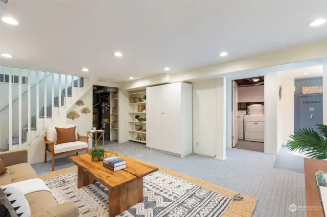 Looking from Family room toward exterior access, utility room, laundry room and hall to bedroom and full bath.