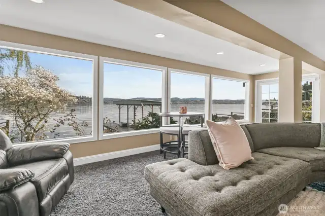 Floor to ceiling windows bathe the living room in natural light even on the grayest of Seattle days!