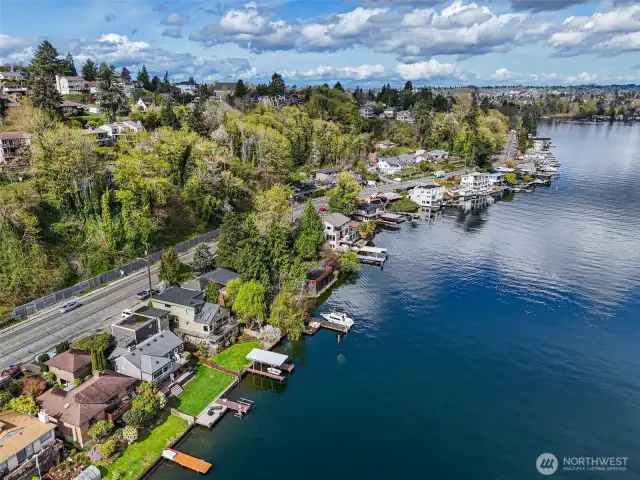 50' of coveted lake front property. Enjoy daily views of Lake Washington from every level of this unique and charming home.