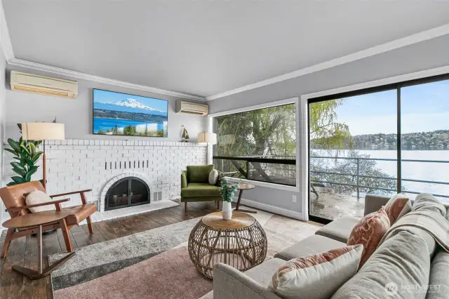 The living and dining room lead to a wrap around deck, perfect for outdoor dining.