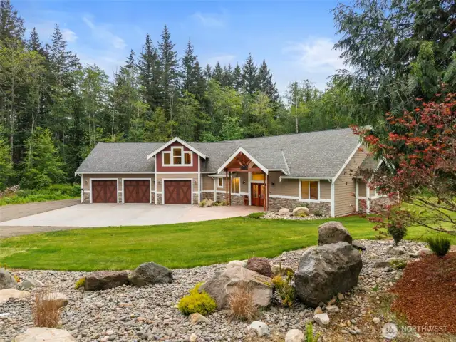 Welcome to 9189 NE Country Woods Lane...on 5 peaceful, private acres!