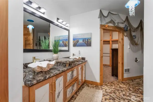 Another shot of the primary bathroom looking into huge closet with cedar built-ins...bidet to the right out of shot.