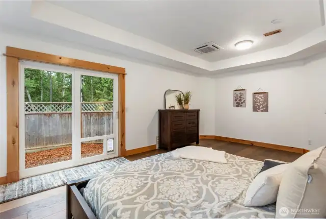 Another shot of the primary bedroom with maple hardwood floors and trey ceilings!