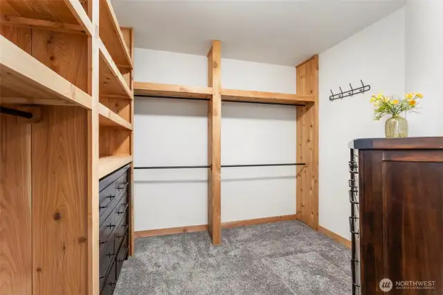Huge primary closet with cedar shelving... approx 120 sqft!