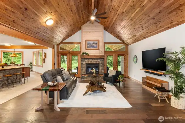Grand entry with 14' cathedral cedar tongue and groove ceilings that span from front entry to back patio! Cedar is from the property!