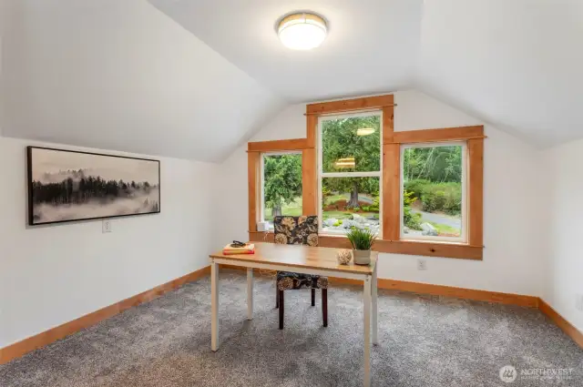 4th bedroom with 3/4 bathroom attached above garage...staged as office.