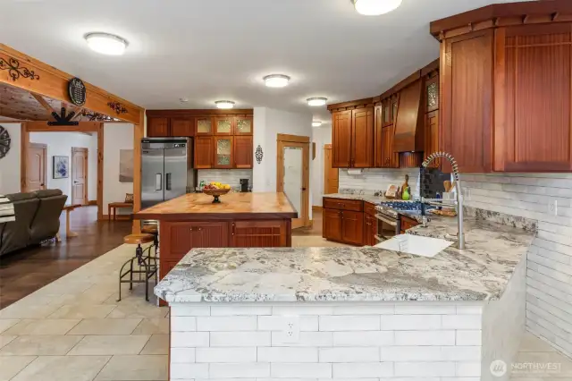 Leathered granite countertops and tile flooring.