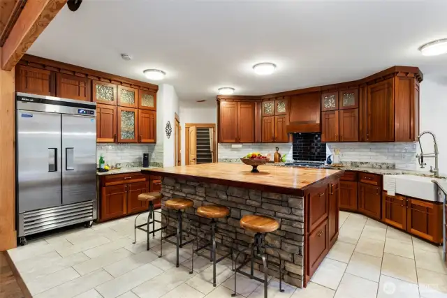 Custom handmade African Sepele Mahogany cabinetry with locally crafted glass inserts.