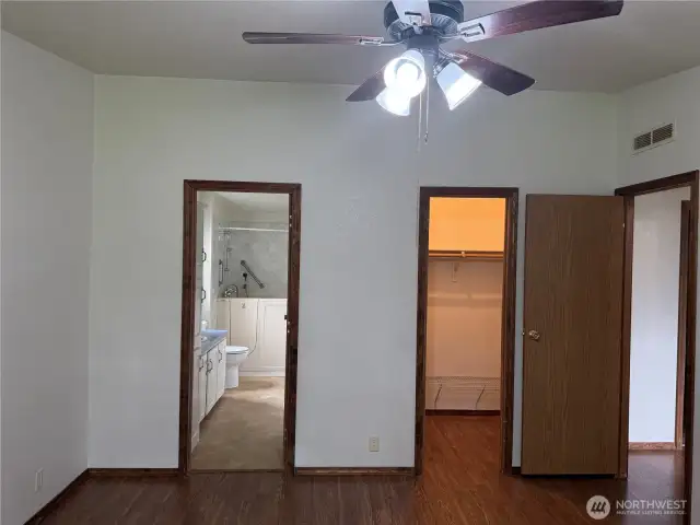 Walk-in closet and primary full bathroom.