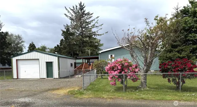Garage and workshop add to the value of this charming home.