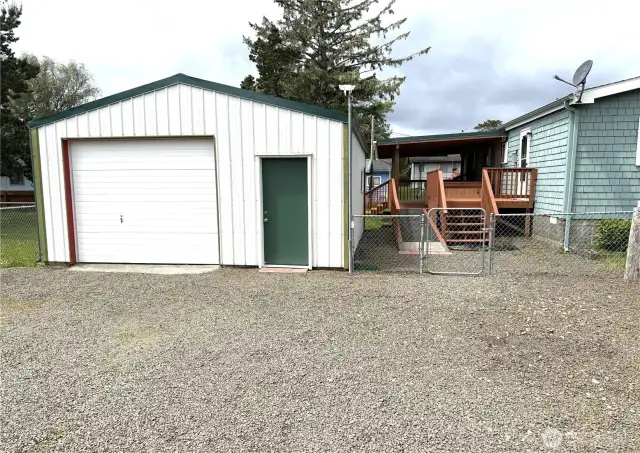Fencing continues on both sides of the garage.