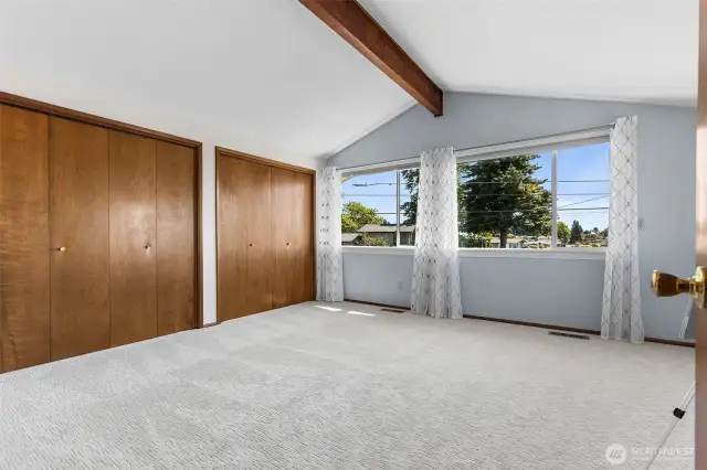 Primary suite upstairs w/ a huge view of the Narrows bridge, vaulted ceilings, and a wall of closets