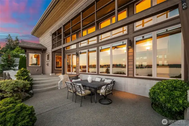 Just off the kitchen, the patio offers a front-row seat to the southern shoreline, where elegant granite details meet nature’s tranquility.