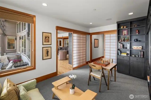 Just off the great room, Shoji screens define a flexible space—ideal as an office, TV room, or quiet retreat. Thoughtful design meets tranquil function.