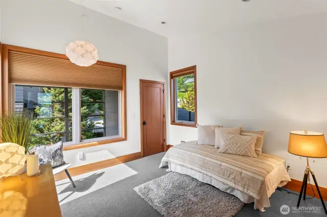 Upper bedroom with private bath, landing area leading to the private roof top deck overlooking Wollochet Bay.
