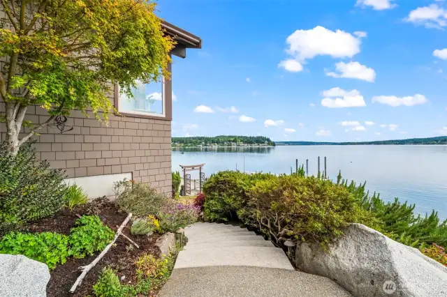 Just off the kitchen, the patio offers a front-row seat to the southern shoreline, where elegant granite details meet nature’s tranquility.