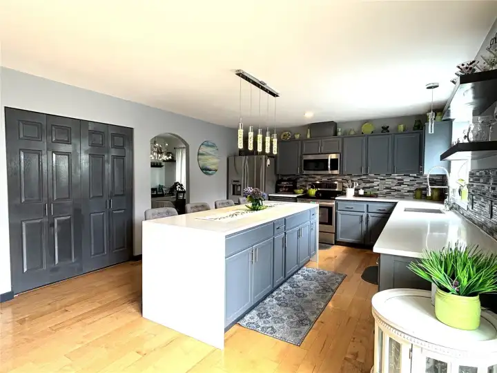 beautiful kitchen with waterfall island