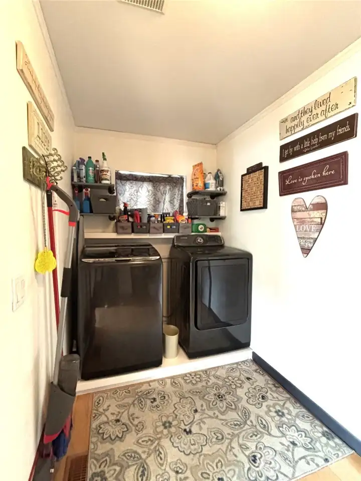 laundry room side with place for washer and dryer