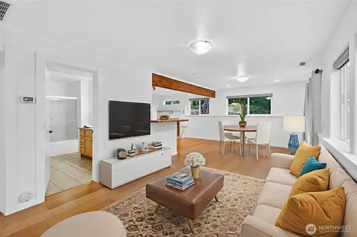 Lower unit living space. Full Bathroom, full kitchen, 1 bedroom w/ walk-in closet. LOTS of natural light.   *virtually staged*