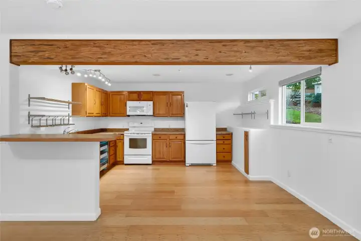 Lower unit has a full kitchen, with breakfast bar.