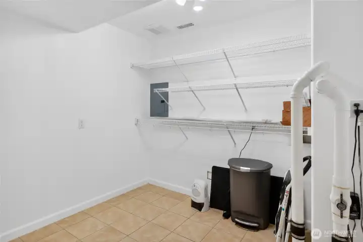 Lower unit utility closet. W/D hook ups. Electrical sub-panel, extra storage space.