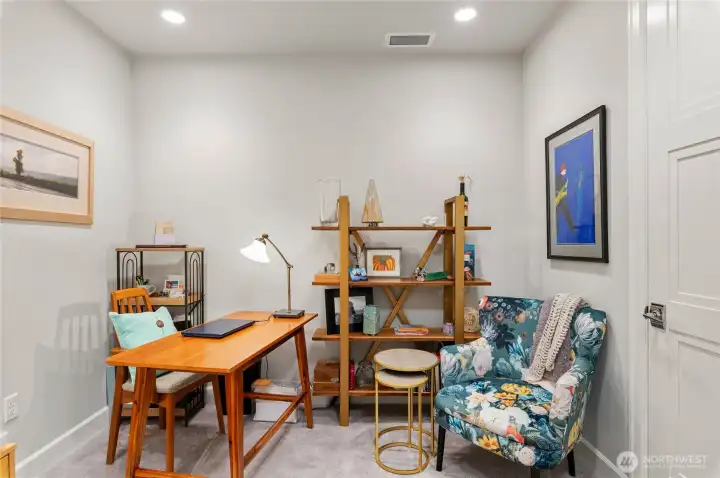 Quiet flex room. Just off the entry, a versatile flex room offers the perfect spot for a stylish home office, cozy guest space, or reading nook. Large closet with custom built-in shelving and storage space.