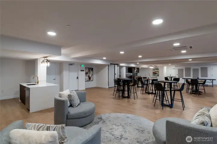 Lounge Seating + Kitchenette Area  Stylish community lounge with inviting conversation areas, wet bar, and sleek modern finishes—ideal for casual gatherings, book clubs, or quiet relaxation.