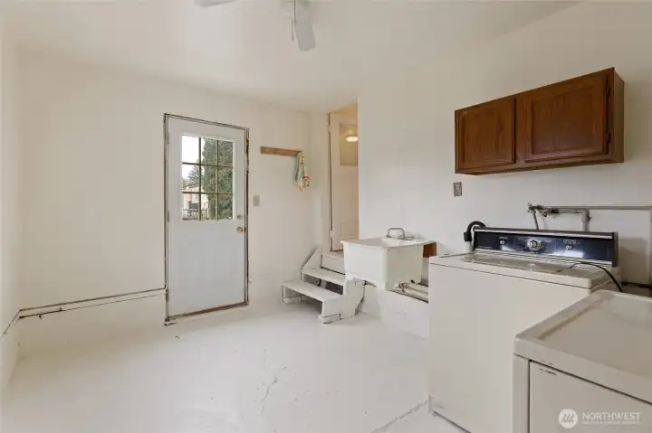 Another view of the laundry room with access to the outside ...