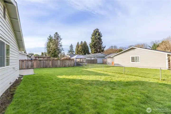 Large level yard with plenty of space to play or relax