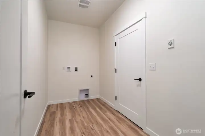 Utility Room connected to Garage - Pics are of a different 2014 plan. Features and colors may differ.