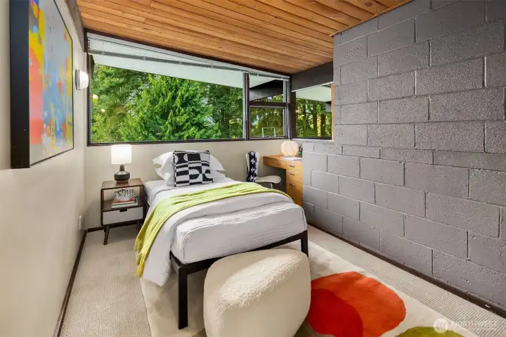 The first room at the top of the stairs features that fun sliding door on either side of the fireplace.  There's a closet just behind us on the right.