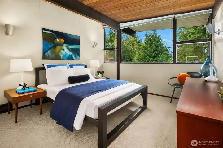 This is the larger of the two upper bedrooms.  A closet occupies the wall to our left, and this room previously had a king bed.