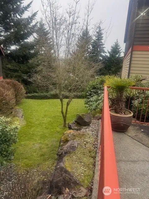 A lawn area is featured alongside this building