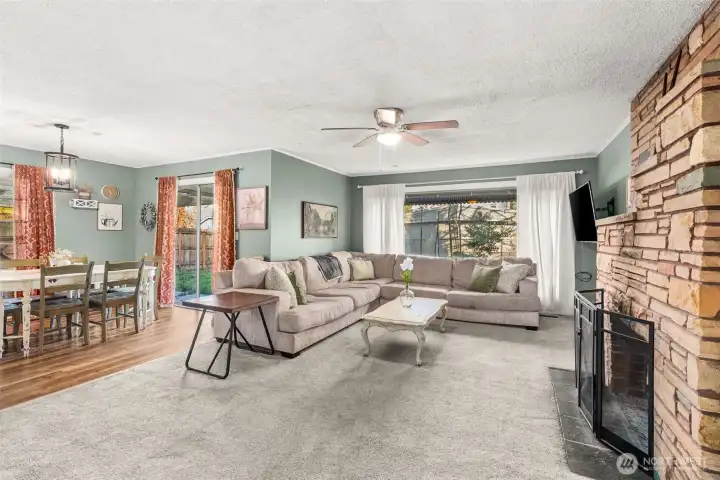 Spacious living room and dining area - kitchen to the left