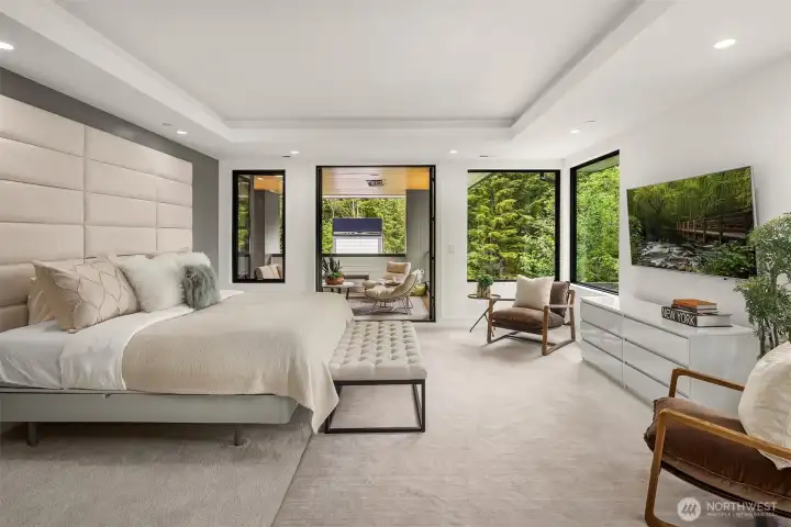 The spacious primary suite offers a private retreat with an abundance of light and your own private heated patio -great for beginning and ending each day!