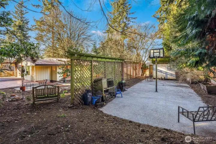 Spacious yard with sport court and large shed