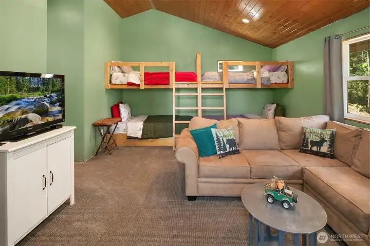 Another view of family/living room with plenty of extra sleeping space for everyone! Built in bunk beds and all bedding included!
