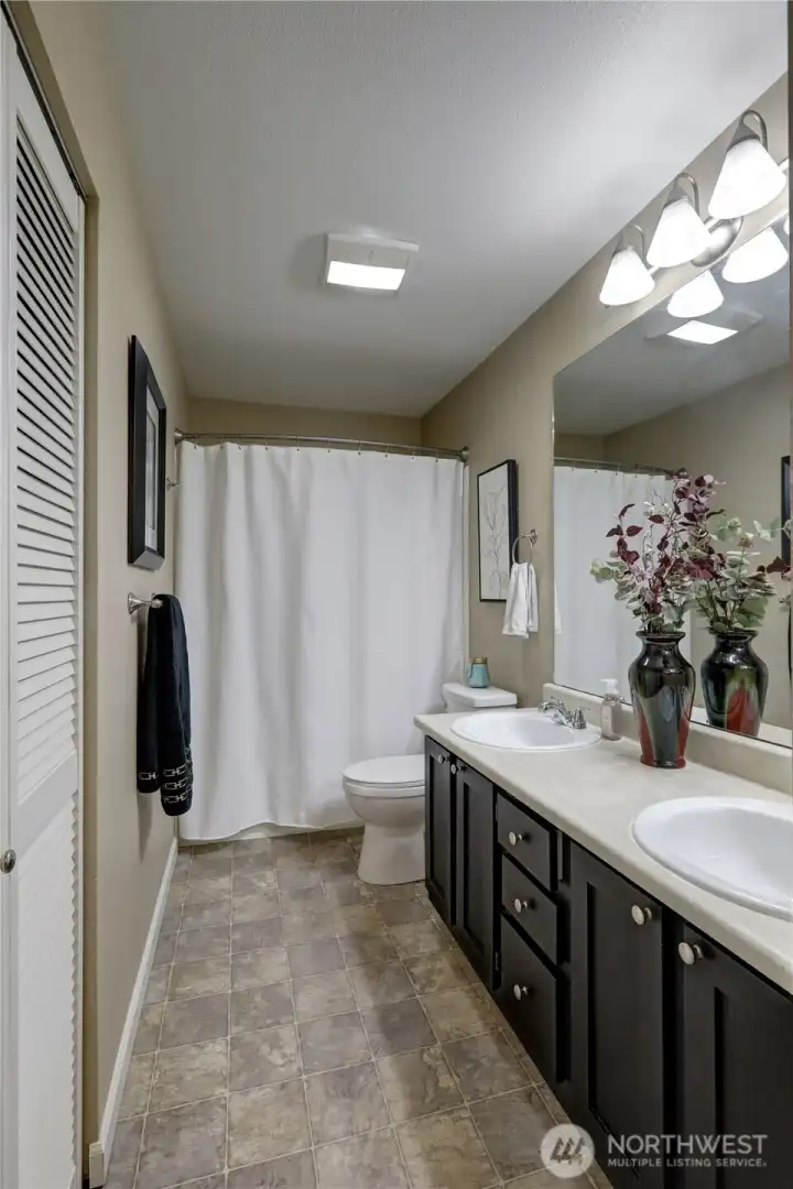 Main Bath - double sinks, new toilets and sinks, full bath with tub and shower