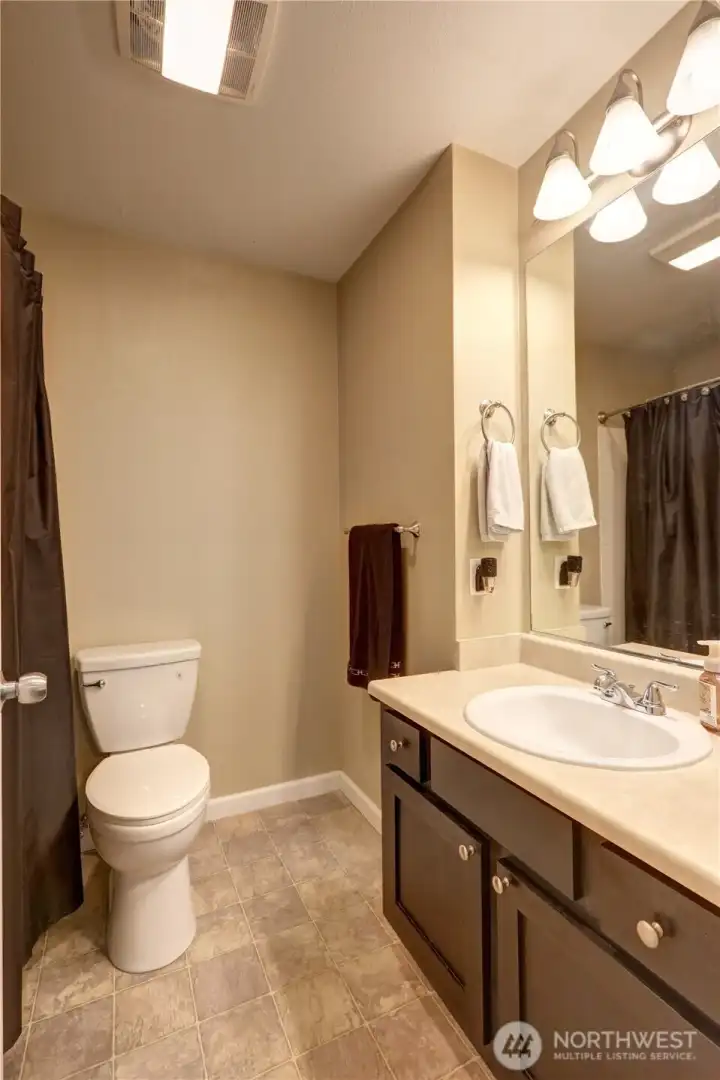 Master bedroom /Primary bedroom bath.  3/4 bath with shower. New sink and newer toilet.