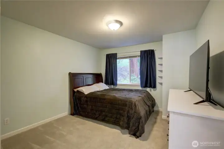 2nd bedroom overlooks treed area