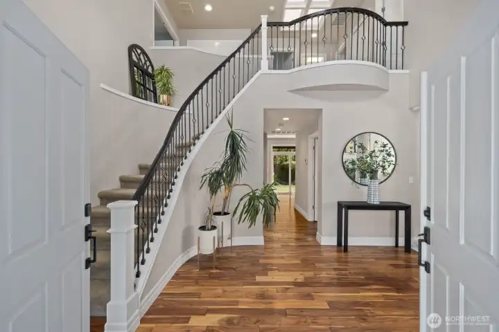 Brazilian Hardwood throught main floor. Plush carpet on upper floor.