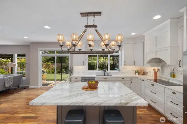 Epicurian kitchen with plenty of storage and easy access to covered patio